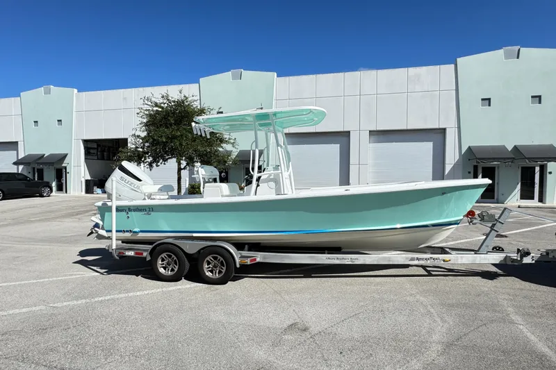  Yacht Photos Pics 2024 Albury Brothers 23 Forward Seating boat on trailer, parked outside a building.