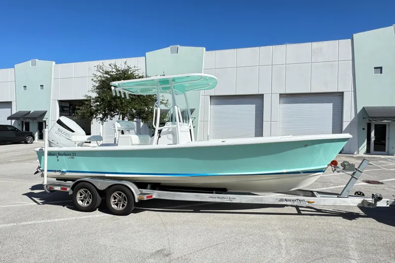  Yacht Photos Pics 2024 Albury Brothers 23 Forward Seating boat on trailer, parked outside industrial building.