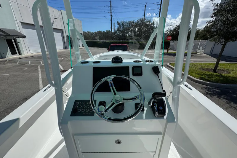  Yacht Photos Pics 2024 Albury Brothers 23 Forward Seating boat console with steering wheel and controls.