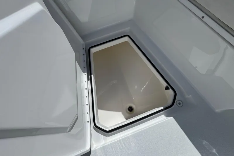  Yacht Photos Pics 2024 Albury Brothers 23 Forward Seating boat storage compartment, open and empty.