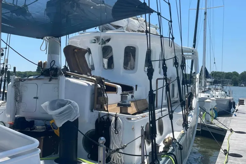 Dauntless Yacht Photos Pics 1989 Custom Schooner Live aboard docked at marina under clear blue sky.