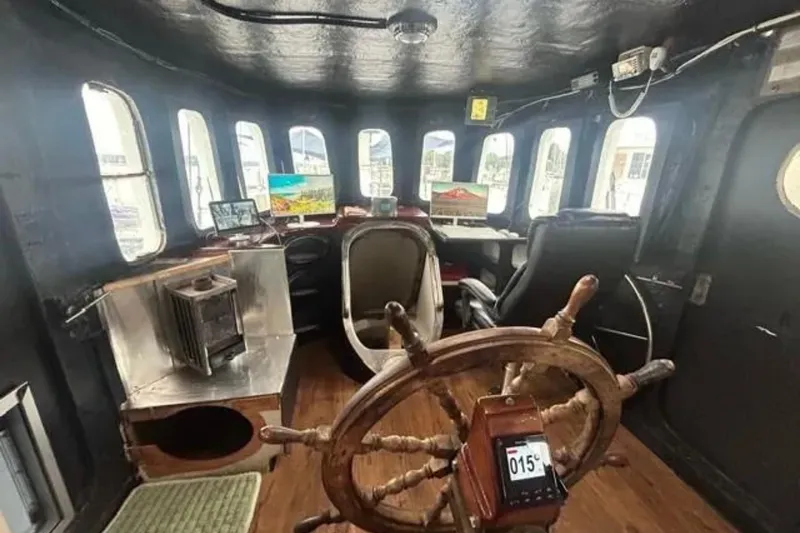 Dauntless Yacht Photos Pics Interior of 1989 Custom Schooner Live aboard with wooden wheel and modern equipment.