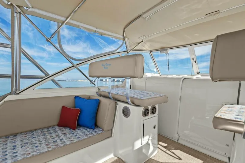 Whattakeeper Yacht Photos Pics 2006 Mainship 34 Rum Runner II interior with beige seating and ocean view.