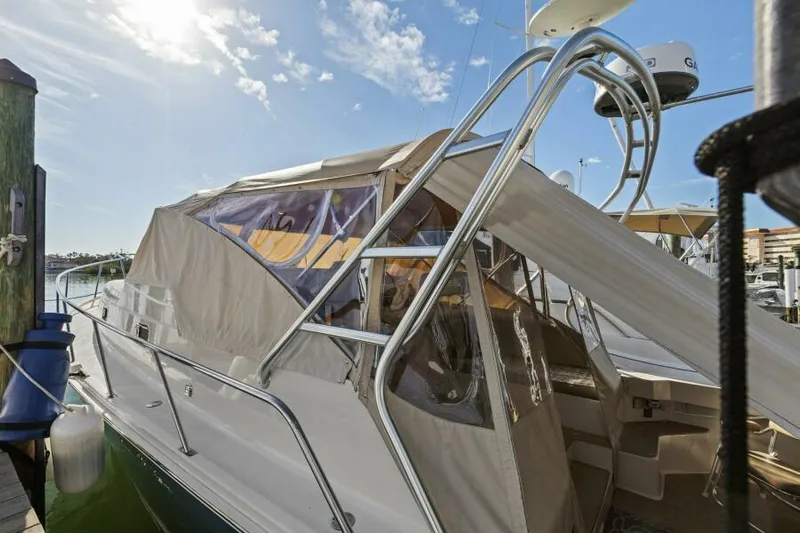 Whattakeeper Yacht Photos Pics 2006 Mainship 34 Rum Runner II docked under a sunny sky.