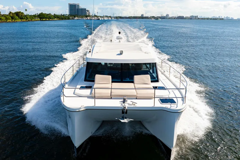  Yacht Photos Pics 2023 Fountaine Pajot MY4.S yacht cruising on open water, showcasing sleek design and luxury.