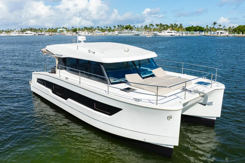  Yacht Photos Pics 2023 Fountaine Pajot MY4.S catamaran on calm water, showcasing sleek design and luxury features.