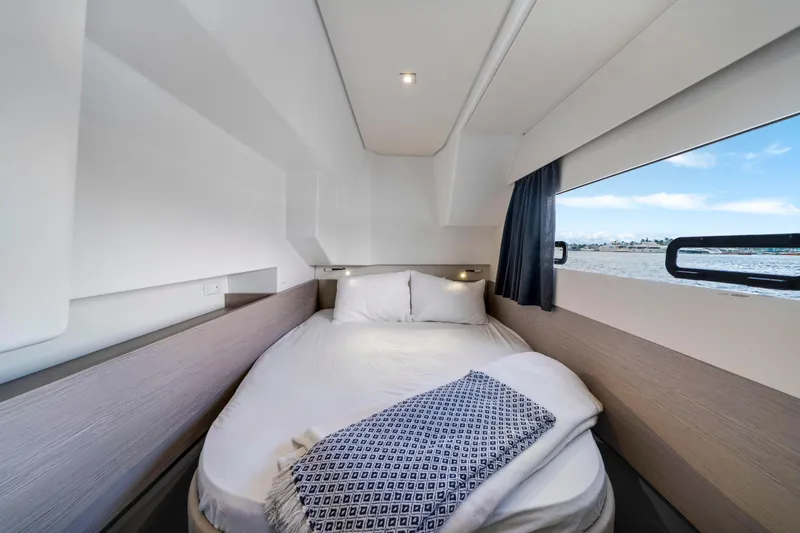  Yacht Photos Pics Luxurious cabin interior of 2023 Fountaine Pajot MY4.S yacht with ocean view.