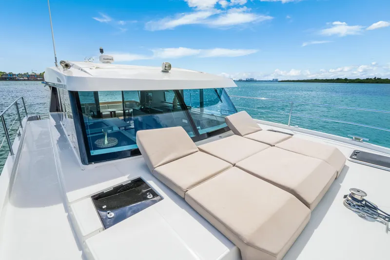  Yacht Photos Pics 2023 Fountaine Pajot MY4.S yacht with sun loungers on deck, ocean view.