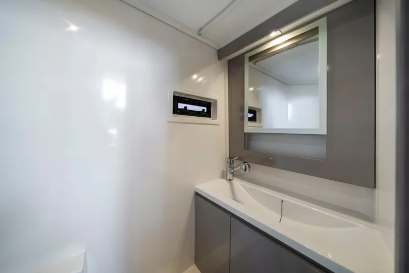  Yacht Photos Pics Modern bathroom interior on 2023 Fountaine Pajot MY4.S yacht, featuring sleek design and fixtures.
