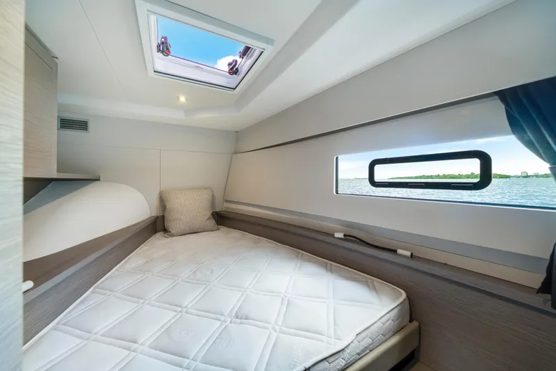  Yacht Photos Pics 2023 Fountaine Pajot MY4.S cabin interior with bed, window view, and skylight.