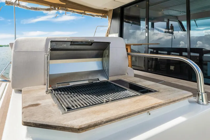  Yacht Photos Pics Outdoor grill on 2023 Fountaine Pajot MY4.S yacht deck, with ocean view.