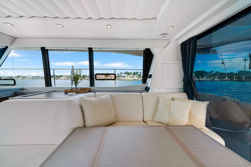  Yacht Photos Pics Luxurious interior of 2023 Fountaine Pajot MY4.S yacht with elegant seating and scenic views.