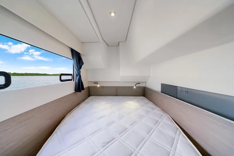  Yacht Photos Pics Luxurious cabin interior of 2023 Fountaine Pajot MY4.S yacht with scenic window view.