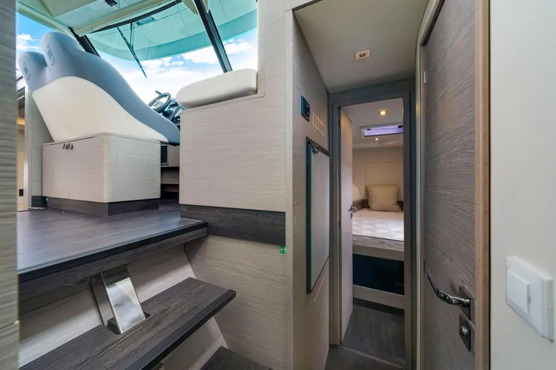  Yacht Photos Pics Interior of 2023 Fountaine Pajot MY4.S yacht, featuring helm and cozy cabin.