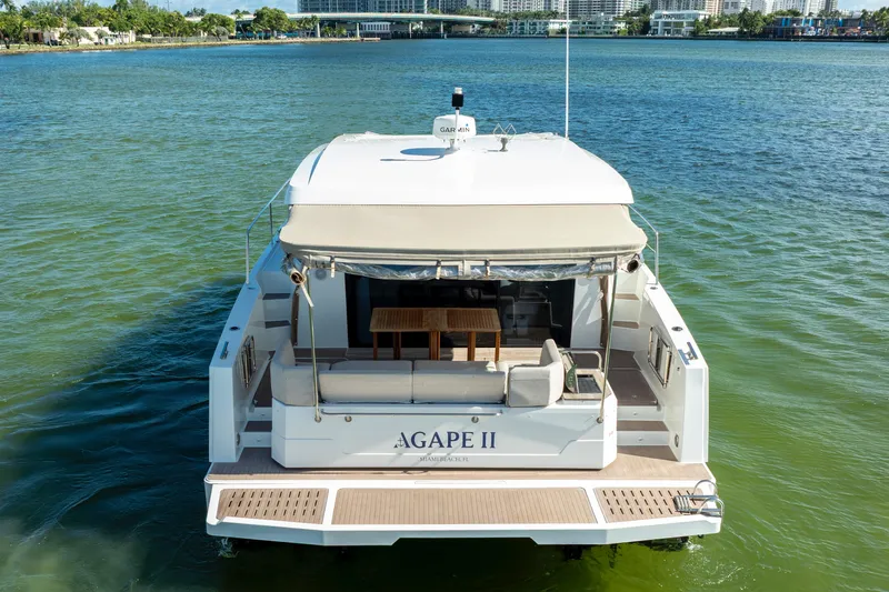  Yacht Photos Pics 2023 Fountaine Pajot MY4.S yacht on water, rear view with seating area.