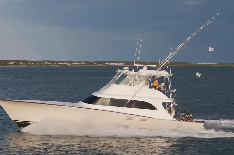 Custom Yacht Photos Pics Sportfishing yacht Weaver 61, 2005 model, cruising on open water.