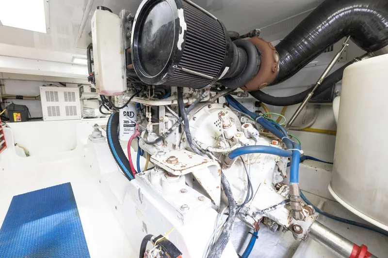 Custom Yacht Photos Pics Engine room of a 2005 Weaver 61 boat, featuring a CAT engine and various components.