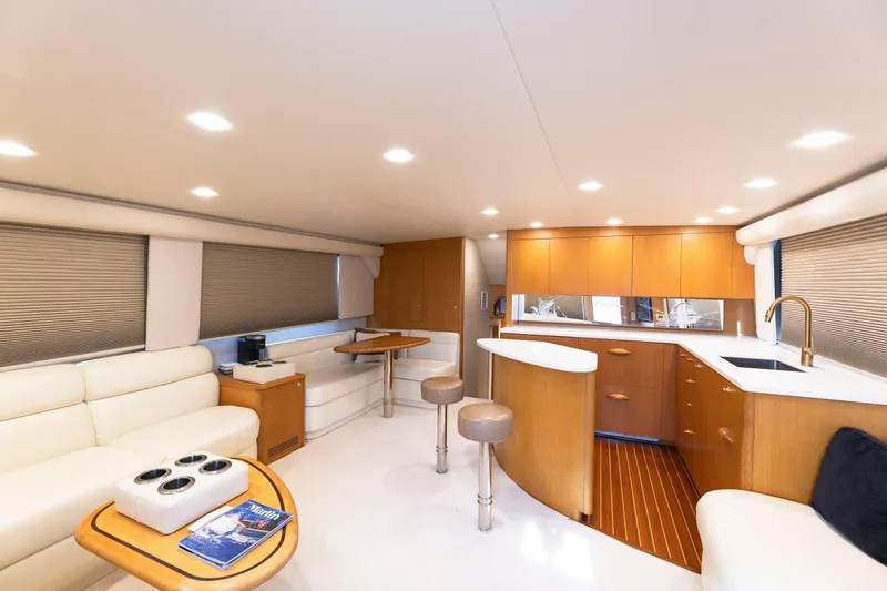 Custom Yacht Photos Pics Luxurious interior of 2005 Weaver 61 yacht with modern kitchen and seating area.