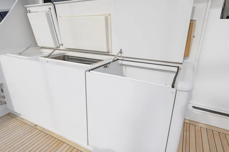 Custom Yacht Photos Pics Open storage compartments on a 2005 Weaver 61 yacht deck.