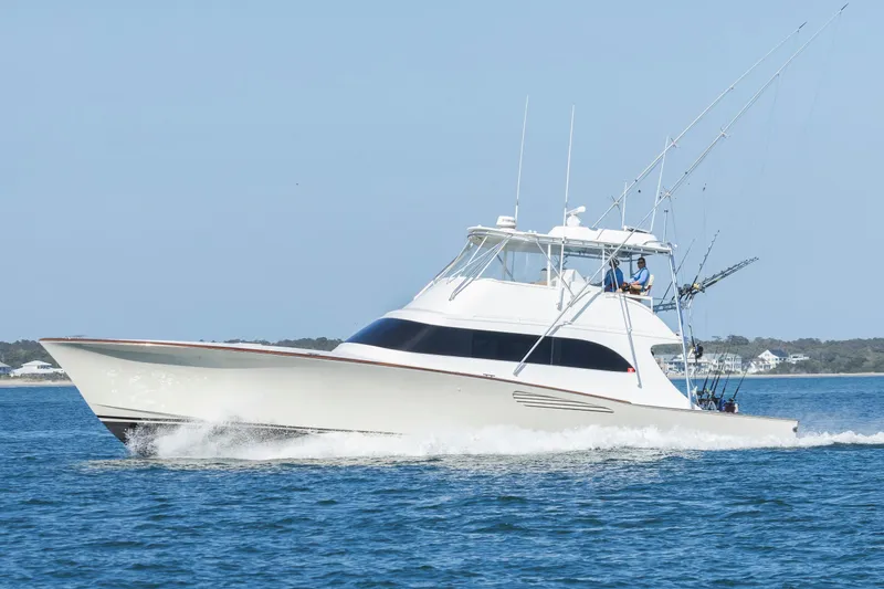 Custom Yacht Photos Pics Sportfishing yacht Weaver 61, 2005 model, cruising on open water.