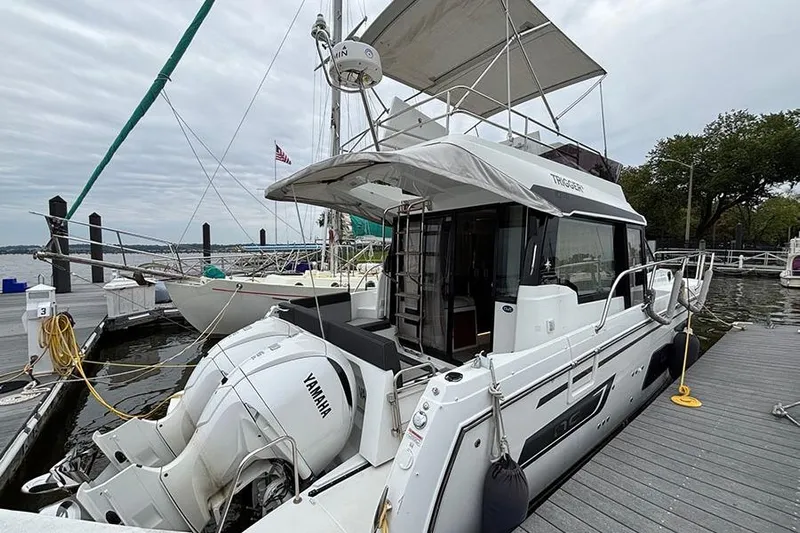  Yacht Photos Pics 2022 Jeanneau NC Weekender 1095 Fly docked, featuring Yamaha engines and spacious flybridge.