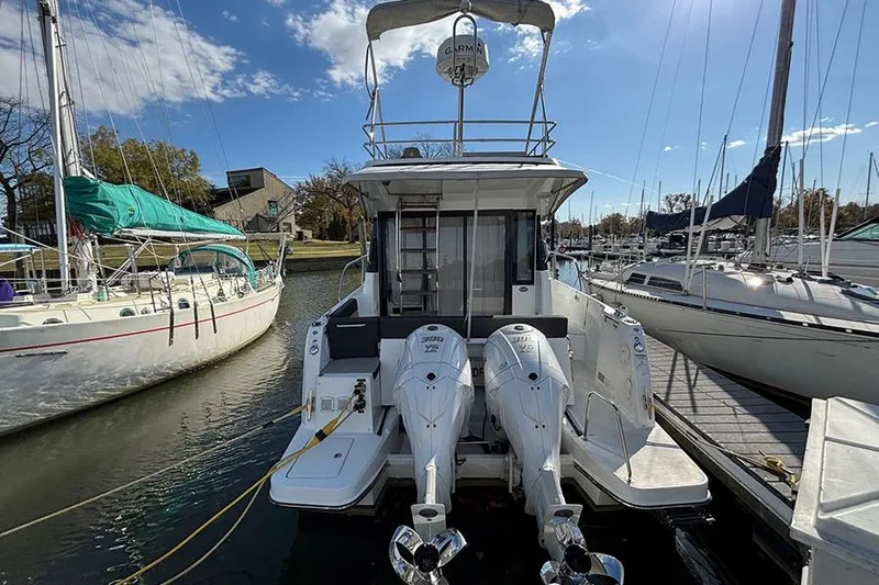  Yacht Photos Pics 2022 Jeanneau NC Weekender 1095 Fly docked with twin outboard engines.