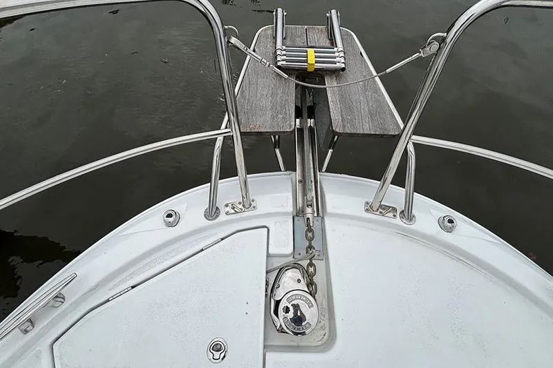  Yacht Photos Pics Bow view of 2022 Jeanneau NC Weekender 1095 Fly, featuring anchor and railing.