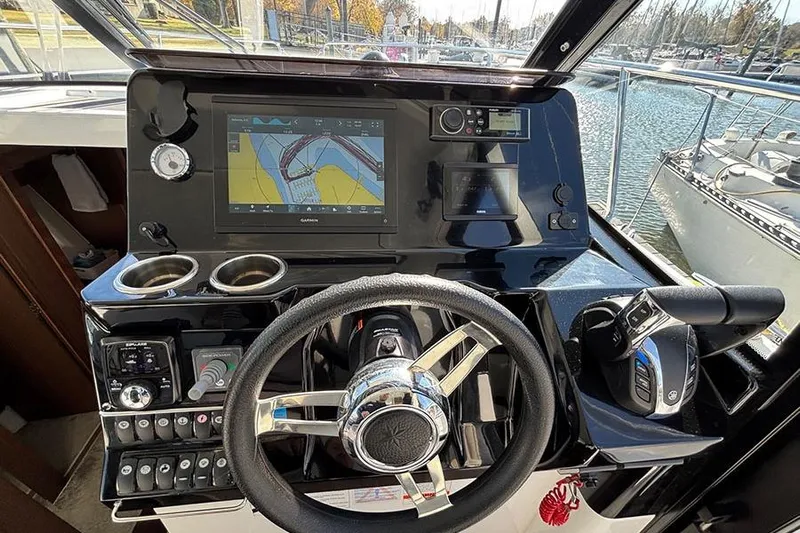  Yacht Photos Pics Helm of 2022 Jeanneau NC Weekender 1095 Fly with navigation display and controls.