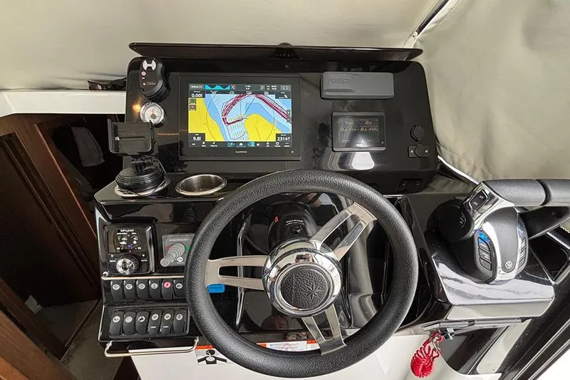  Yacht Photos Pics Helm of 2022 Jeanneau NC Weekender 1095 Fly with navigation display and controls.