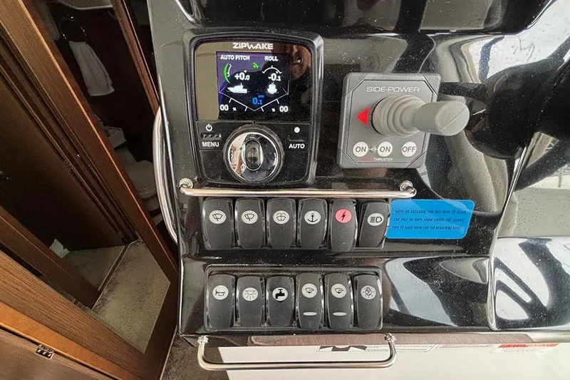  Yacht Photos Pics Control panel of 2022 Jeanneau NC Weekender 1095 Fly with Zipwake and Side-Power systems.