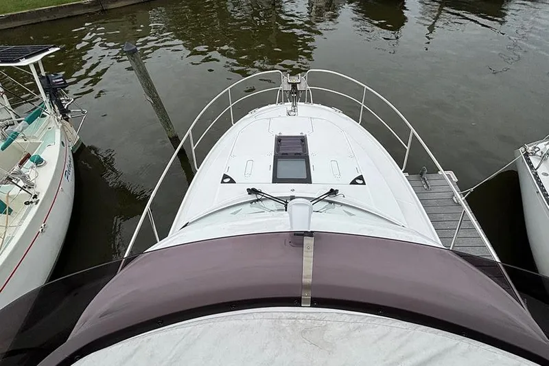  Yacht Photos Pics 2022 Jeanneau NC Weekender 1095 Fly docked, aerial view of bow and deck.