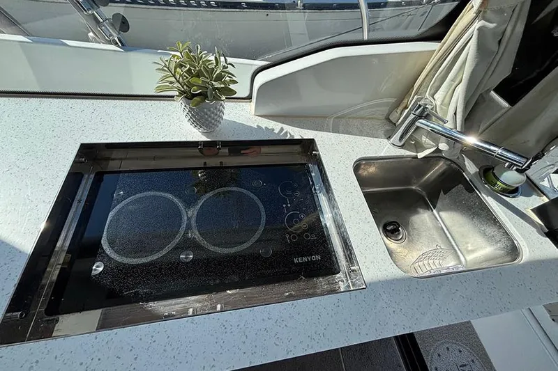  Yacht Photos Pics Modern kitchen area on 2022 Jeanneau NC Weekender 1095 Fly boat.