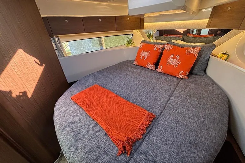  Yacht Photos Pics Luxurious cabin interior of 2022 Jeanneau NC Weekender 1095 Fly with cozy bedding.