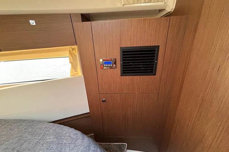  Yacht Photos Pics Interior of 2022 Jeanneau NC Weekender 1095 Fly with wood paneling and vent.