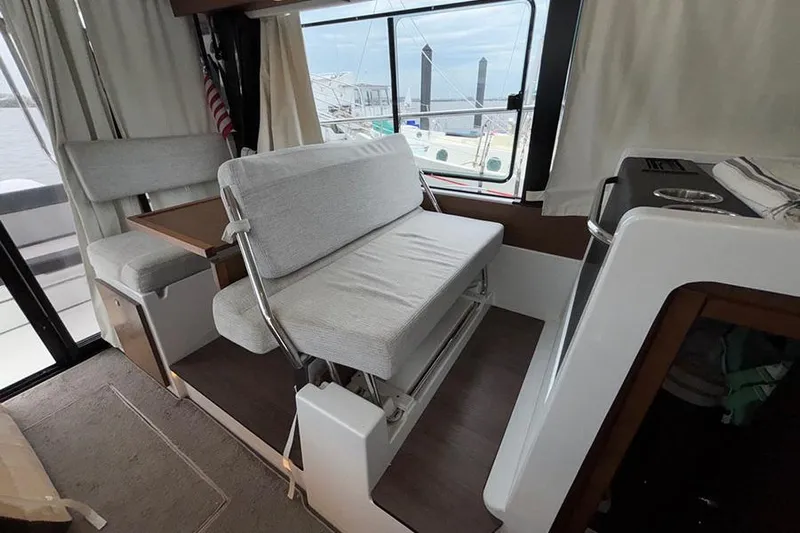  Yacht Photos Pics Interior of 2022 Jeanneau NC Weekender 1095 Fly with seating and dining area.
