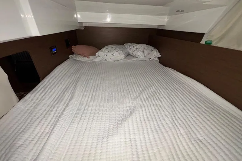  Yacht Photos Pics Cozy cabin bed in 2022 Jeanneau NC Weekender 1095 Fly boat interior.