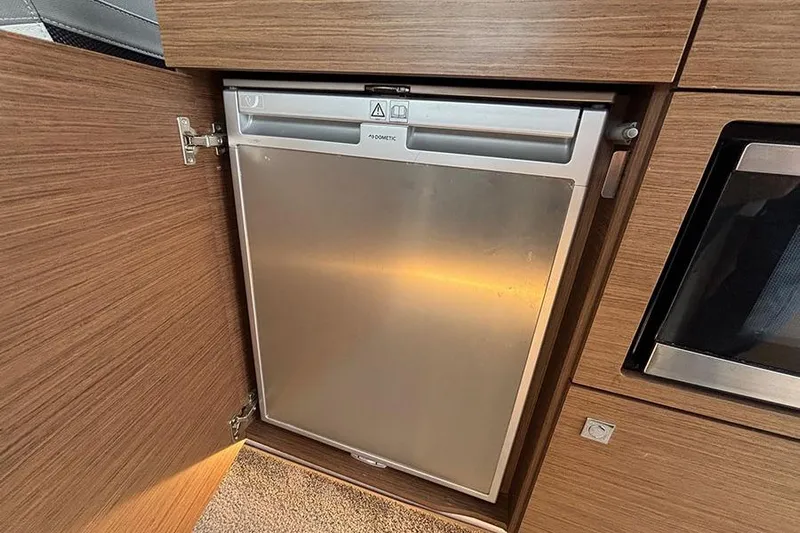  Yacht Photos Pics Compact fridge in 2022 Jeanneau NC Weekender 1095 Fly boat interior.