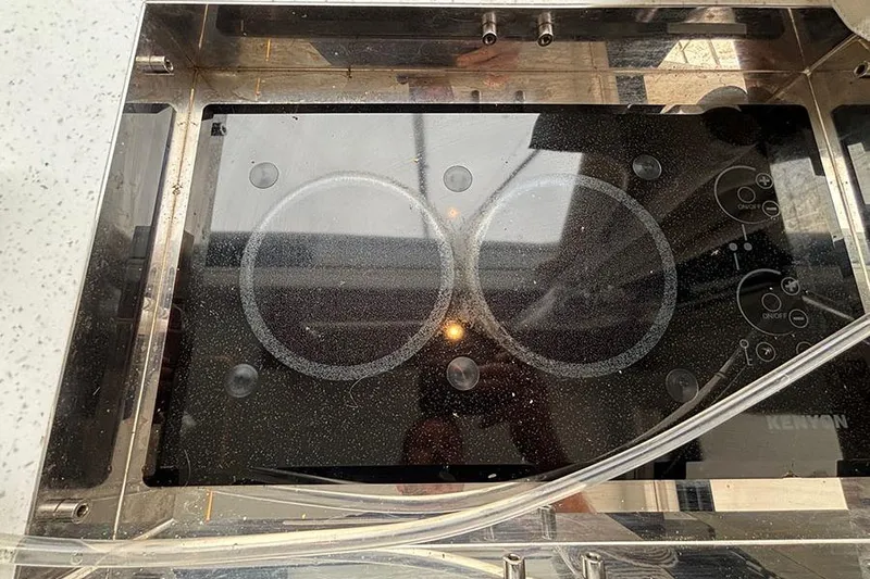  Yacht Photos Pics Glass cooktop on Jeanneau NC Weekender 1095 Fly, 2022 model.