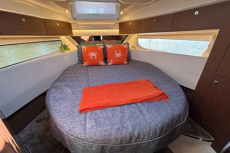  Yacht Photos Pics Luxurious cabin interior of 2022 Jeanneau NC Weekender 1095 Fly with cozy bedding.