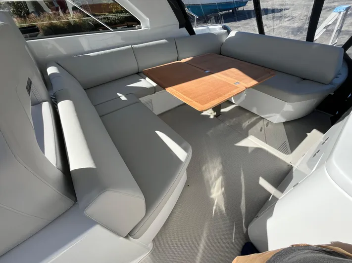  Yacht Photos Pics Luxurious seating area on 2025 Beneteau Gran Turismo 41 yacht with elegant table.