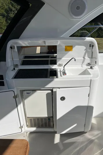  Yacht Photos Pics 2025 Beneteau Gran Turismo 41 yacht kitchenette with sink and grill.
