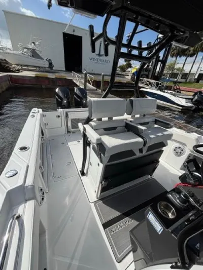  Yacht Photos Pics 2022 Blackfin 302 CC boat interior with dual seats and modern controls.