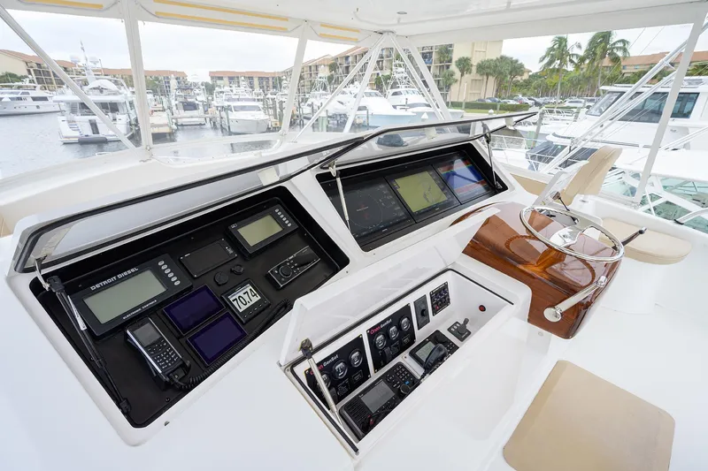  Yacht Photos Pics Viking 61 yacht helm station, 2005 model, featuring advanced navigation controls and luxurious seating.