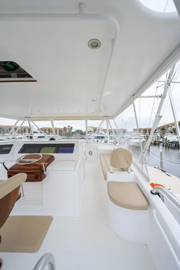  Yacht Photos Pics 2005 Viking 61 yacht interior with helm, seating, and marina view.