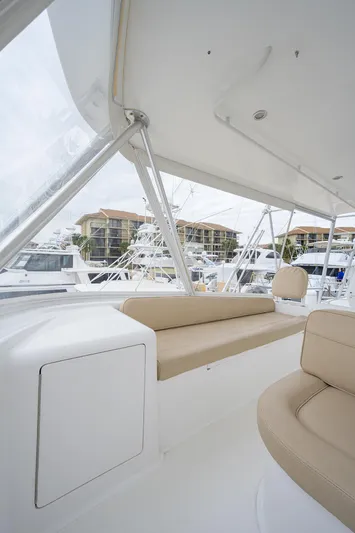  Yacht Photos Pics 2005 Viking 61 yacht interior with beige seating and marina view.