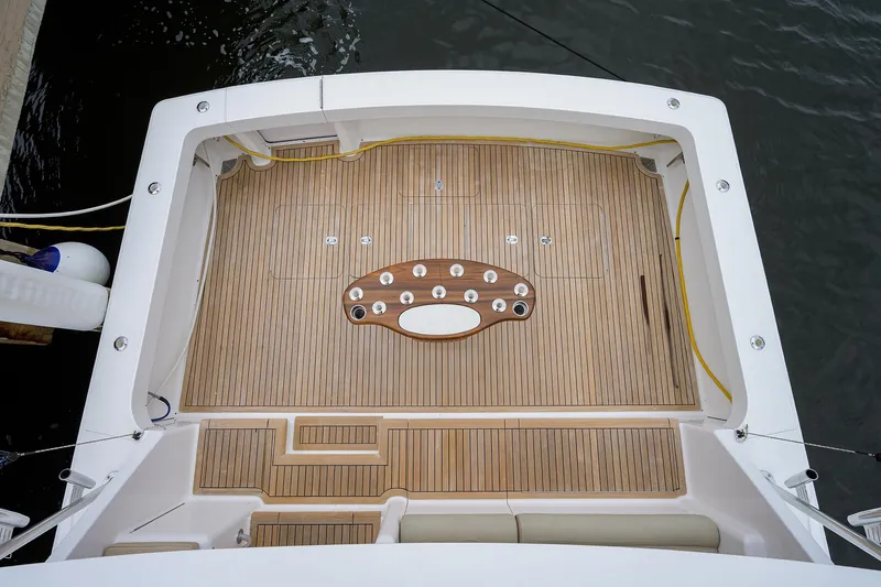  Yacht Photos Pics Viking 61 yacht deck, 2005 model, featuring teak flooring and fishing rod holders.