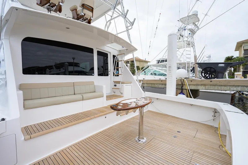  Yacht Photos Pics 2005 Viking 61 yacht with spacious deck and seating area at marina.