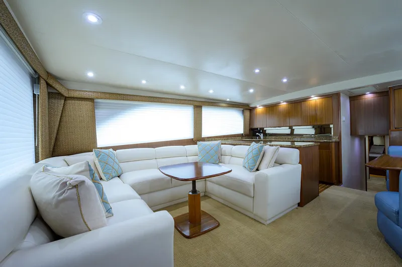 Yacht Photos Pics Luxurious interior of a 2005 Viking 61 yacht with plush seating and modern decor.