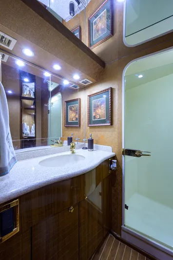  Yacht Photos Pics Luxurious bathroom in 2005 Viking 61 yacht with elegant decor and modern amenities.