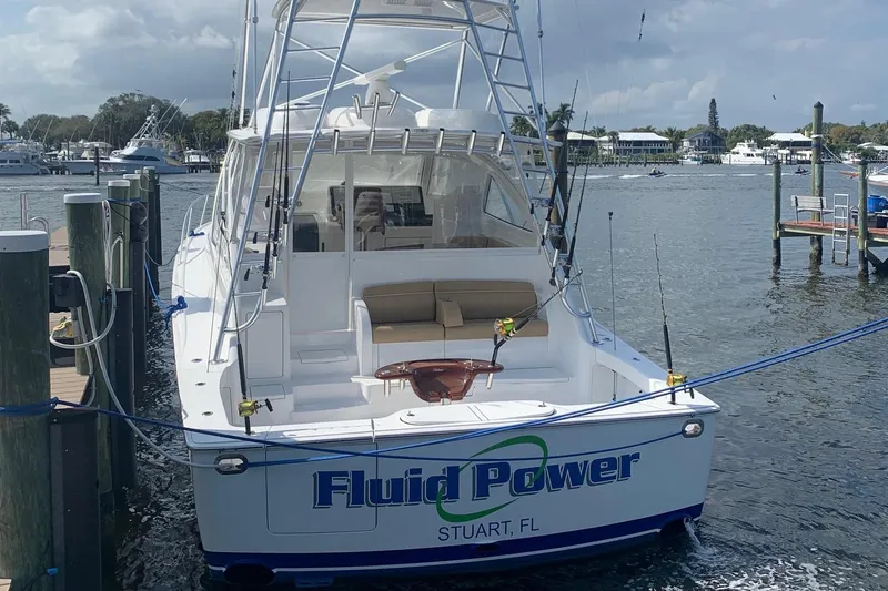 Fluid Power Yacht Photos Pics 2019 Viking 44 Sport Coupe yacht docked in Stuart, FL marina.